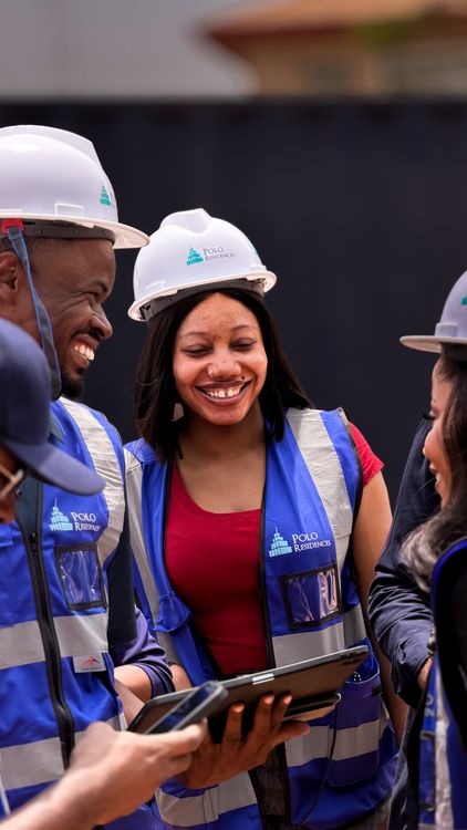 Diverse construction professionals collaborating on site